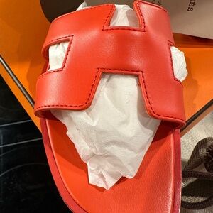 Hermes Oran sandals new in box in vibrant orange coral
Size 38